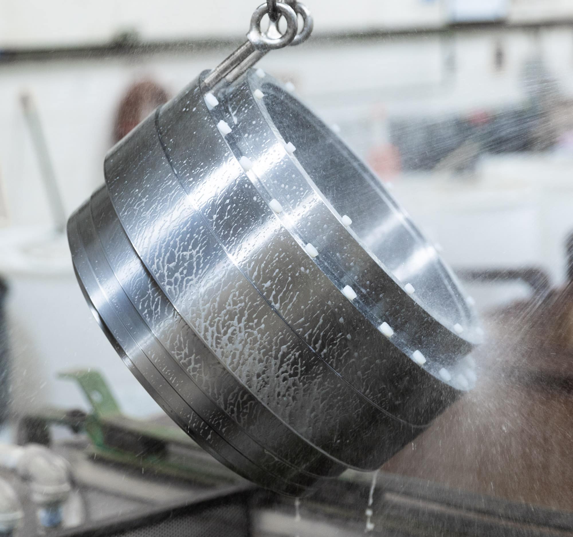 large part being rinsed before the Armoloy thin dense chrome plating process