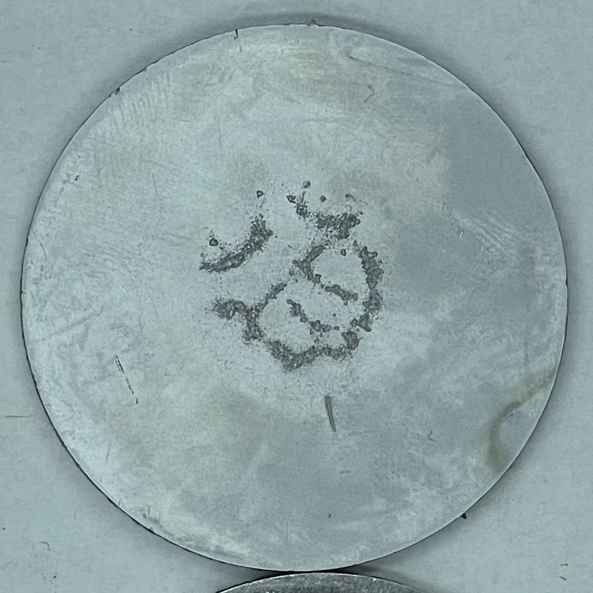 cavitation damage shown on metal coupon