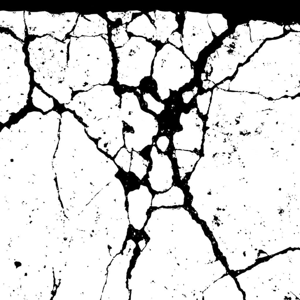 Intergranular corrosion of metal surface seen at x2000 magnitude