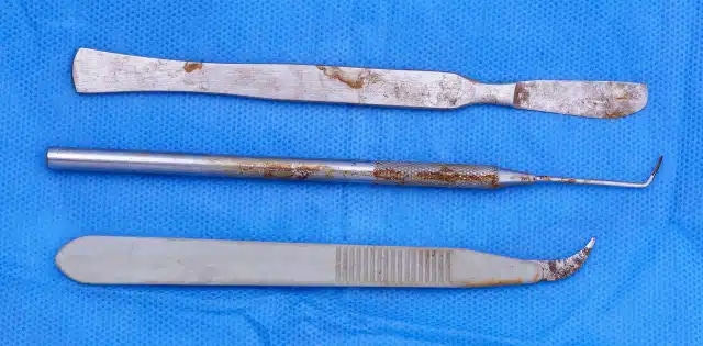 stainless steel medical instruments showing signs of wear from lack of surgical coating