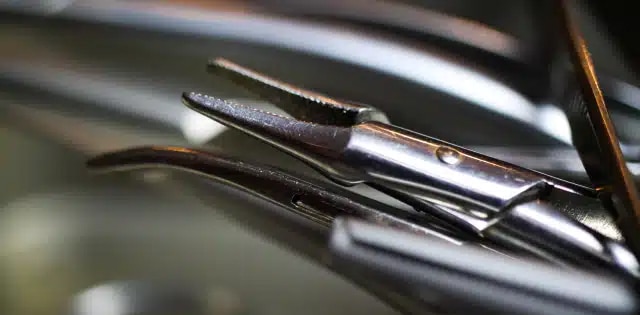 reducing wear in surgical scissors with biocompatible thin dense chrome