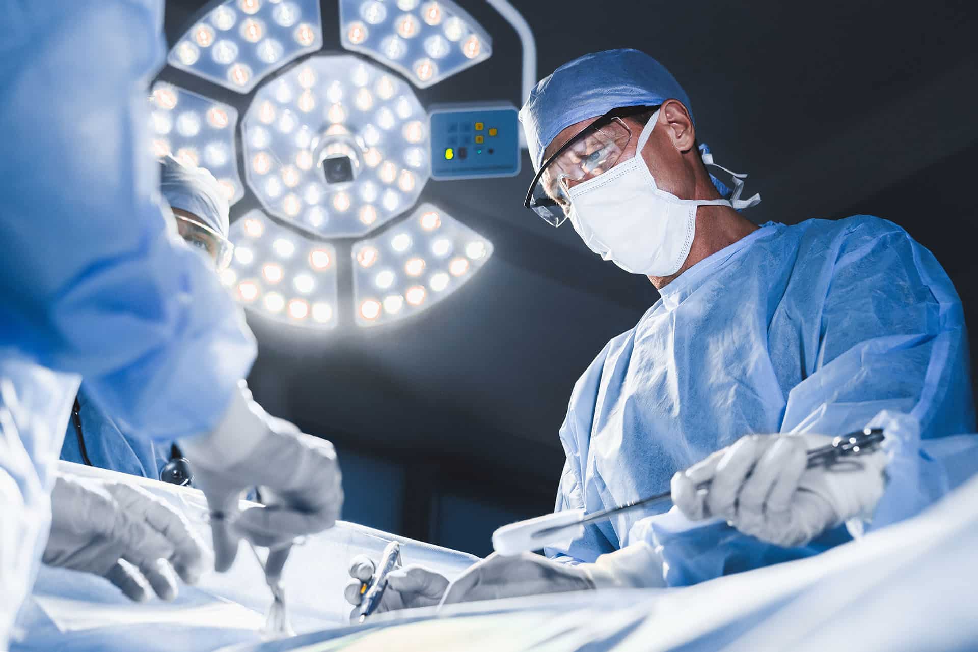 Surgical team operating with Armoloy-coated tools