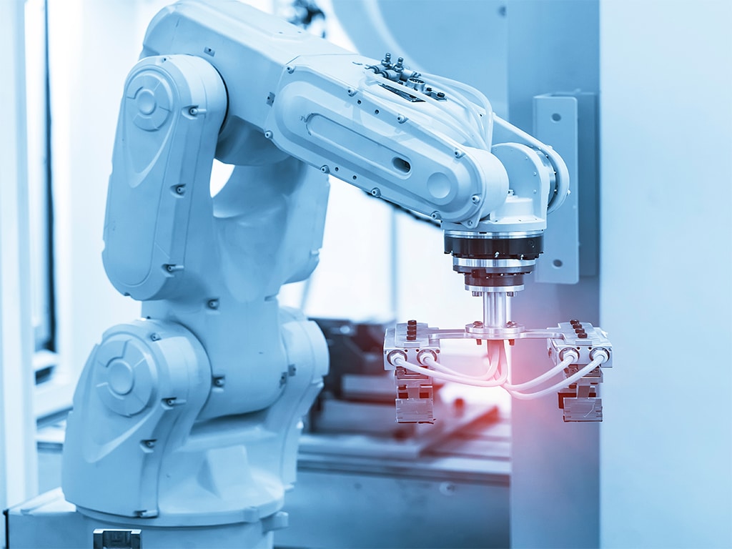 smart robot with armoloy coating working in automated medical device factory