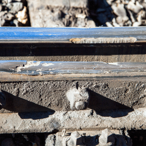 tribocorrosion in the form of contact fatigue corrosion is seen on a worn train rail
